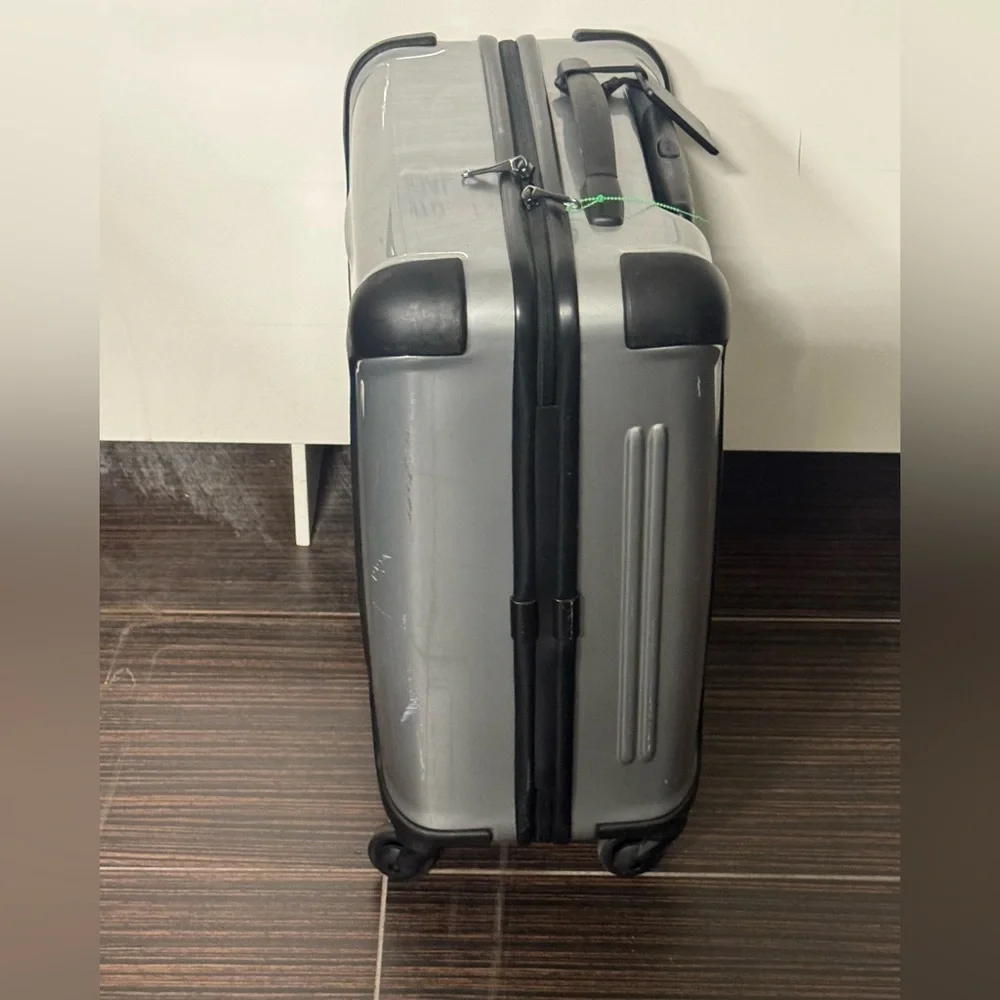 Tumi Vapor Silver and Black Hardside Spinner Carry-On
